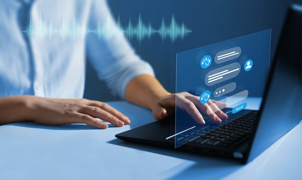 Hands typing on a laptop with voice wave and chatbot message overlays, showing how BPO uses voice process and non-voice process to manage customer support.