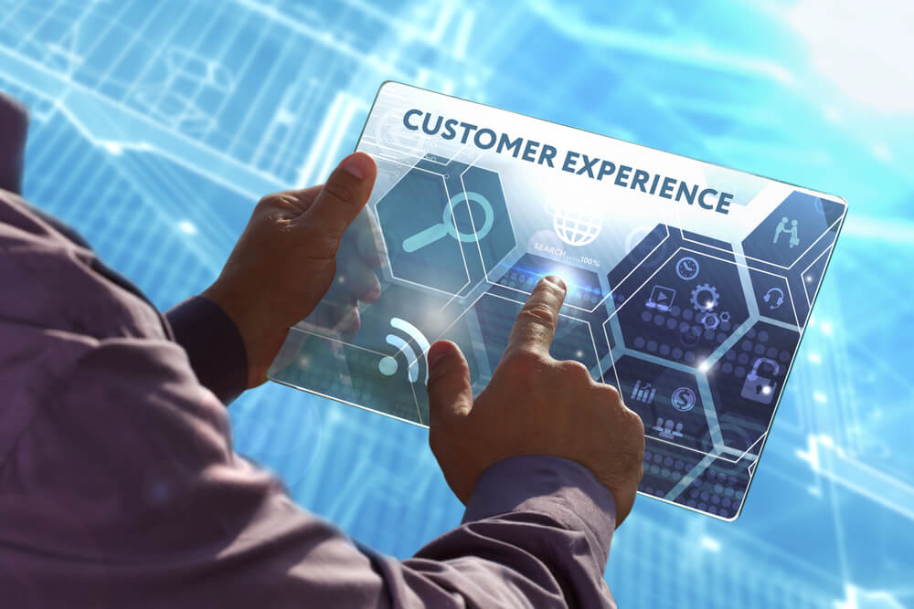 Business, Technology, Internet and network concept. Young business man working on the tablet of the future, select the virtual screen: Customer experience.