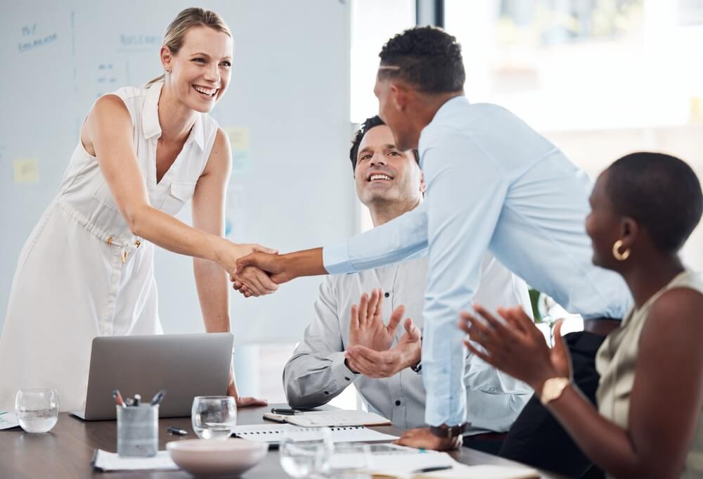 Handshake, team and agreement on business partnership meeting, merger, acquisition or success on B2B collaboration deal. 