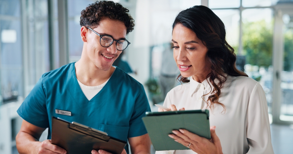 Doctors, coworking and people in clinic, tablet and connection with email for research funding. Employees, diagnosis and medical with professional, healthcare or tech with smile and analyzing results.